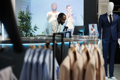 Rear view of couple standing in store