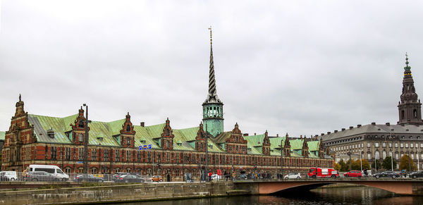 Borsen building and christiansborg palace against sky