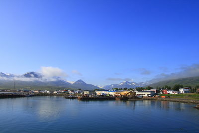 Scenic view of lake against blue sky