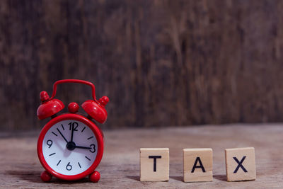 Close-up of clock on table