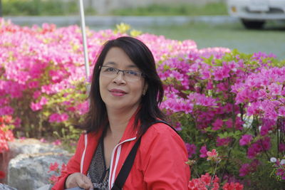 Portrait of smiling woman standing outdoors