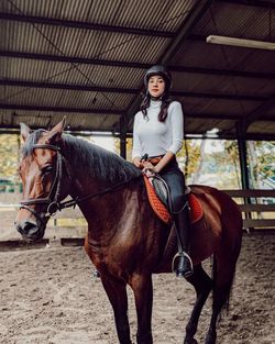 Portrait of woman riding horse