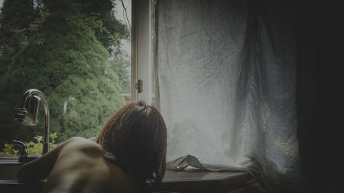 Woman waking up by the window