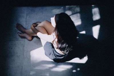 Young woman lying down at home