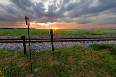 Scenic view of field against sky during sunset