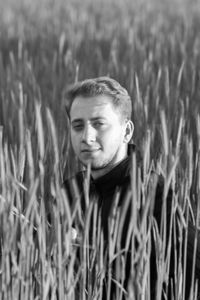 Portrait of young man in field