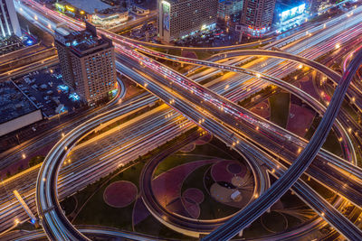 High angle view of light trails on road at night