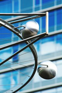 Low angle view of artwork made from bicycle wheel