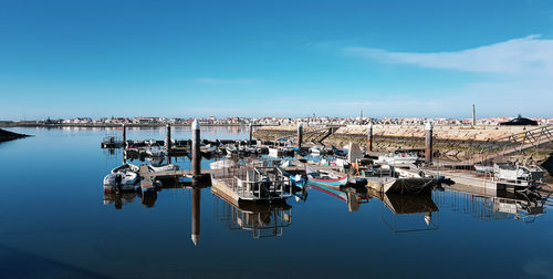 Boats moored in harbor