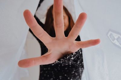 Close-up of hands on glass