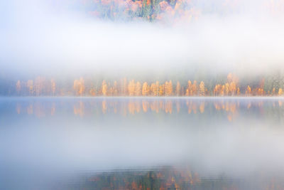 Scenic view of lake against sky during autumn