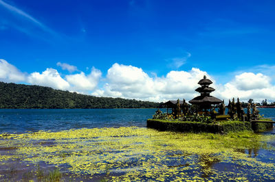 Scenic view of lake against blue sky