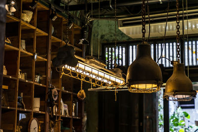 Low angle view of illuminated lanterns hanging on ceiling