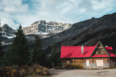 Building with mountain range in background