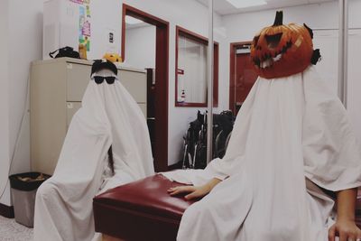 Midsection of doctor examining patient in hospital