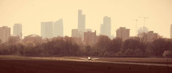 View of city buildings against sky