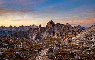 Scenic view of snowcapped mountains against sky during sunset