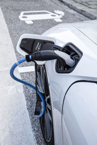 Electric car gettig charged at an charging station