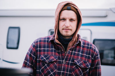 Portrait of young man standing outdoors