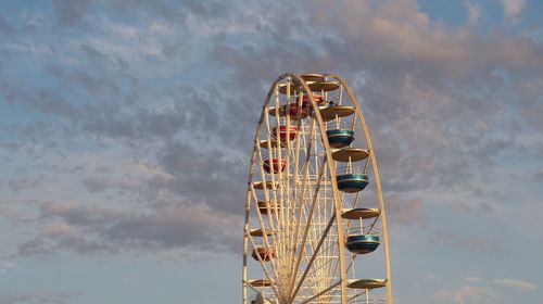 Low angle view of ferris wheel against sky