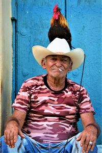 Portrait of smiling young man wearing hat