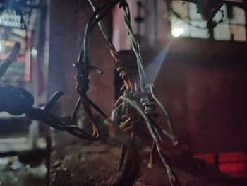 Close-up of bicycle parked at night