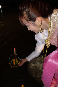 Side view of young woman looking away