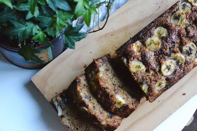 High angle view of banana bread slices on cutting board