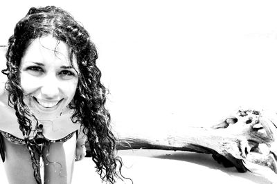 Portrait of a smiling girl over white background