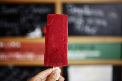 Close-up of hand holding ice cream cone