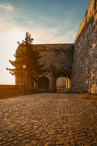 Exterior of old building against sky during sunset