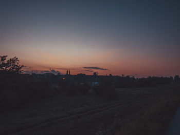 Scenic view of field against sky during sunset