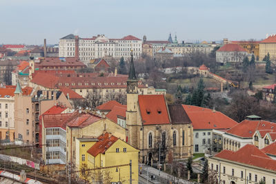 High angle view of buildings in town against sky