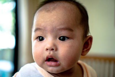 Portrait of cute baby boy at home