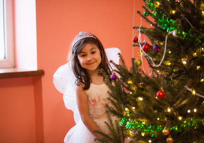 Portrait of girl with christmas tree