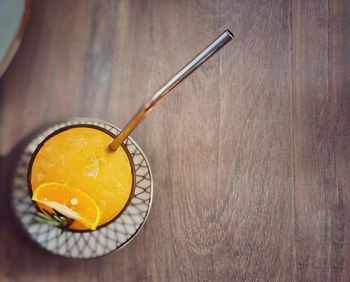 Close-up of orange juice on table