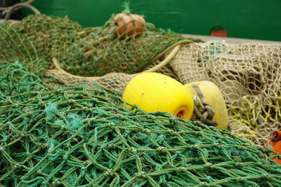 Close-up of buoy on fishing net