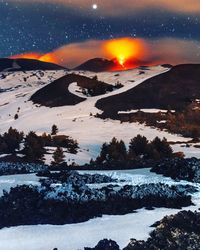 Scenic view of landscape against sky at night