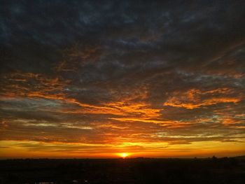 Scenic view of dramatic sky during sunset