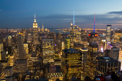 Aerial view of illuminated buildings in city at night