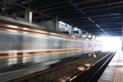 Blurred motion of train at railroad station