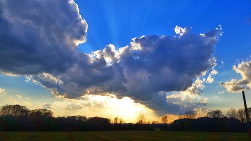 Scenic view of landscape against sky at sunset