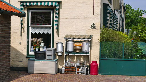 Potted plant on table by building