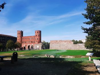 View of old building against cloudy sky