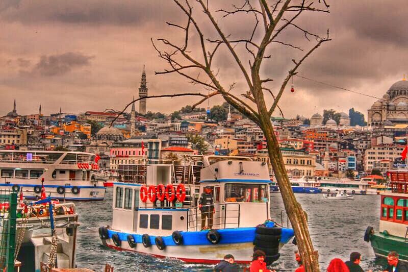 nautical vessel, building exterior, architecture, built structure, water, moored, boat, sky, transportation, mode of transport, cloud - sky, harbor, sea, cloudy, city, residential structure, residential building, town, residential district, waterfront