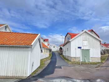 A view of red wooden houses on vrango archipelago island .