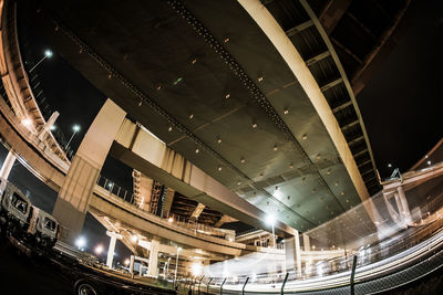 Low angle view of illuminated buildings in city at night