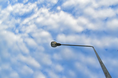 Low angle view of street light against sky