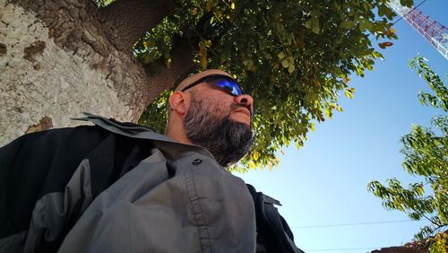 Low angle view of man looking at camera