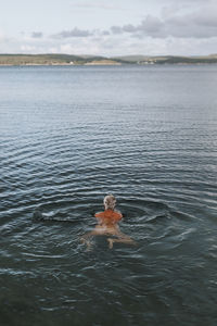 Woman swimming in sea